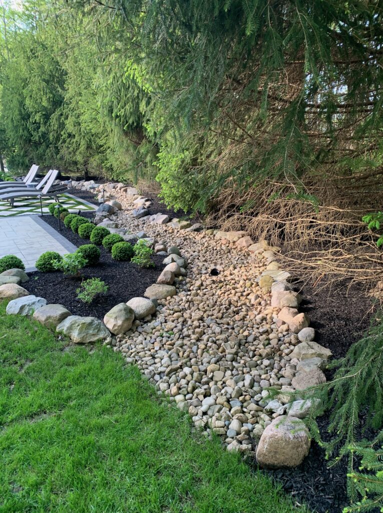 Custom dry bed with decorative rocks